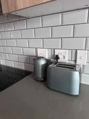 a toaster sitting on a counter in a kitchen at Secure 1 Bedroom Apartment in Midrand, Waterfall City - Lock Up and Go - Free WIFI and Parking - 9 Elizabeth Place in Midrand