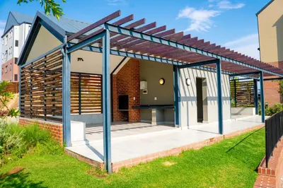 a roof extension of a house with a patio at Secure 1 Bedroom Apartment in Midrand, Waterfall City - Lock Up and Go - Free WIFI and Parking - 9 Elizabeth Place in Midrand