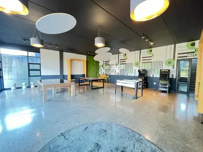 a large room with tables and ping pong tables at Spacious 2 Bedroom Apartment in Midrand, Waterfall City - Business and Family friendly - 11 Elizabeth Place in Midrand