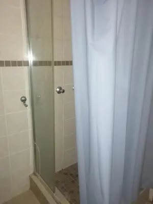 a shower with a shower curtain in a bathroom at GLORIA'S GUESTS.COM in Polokwane