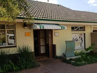 a small house with a sign in front of it at 40 on Ilkey B&B in Pretoria