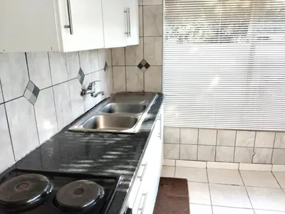 a kitchen with a sink and a counter top at Turquoise View Guesthouse in Middelburg