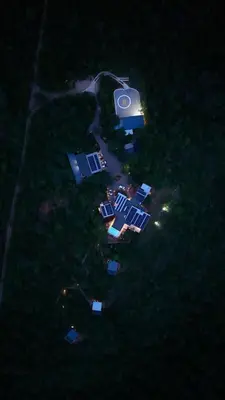 an aerial view of a house in the grass at night at umVangati House in Hoedspruit