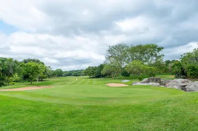 a view of a golf course with a green at Kruger Park Lodge Unit No. 246 in Hazyview