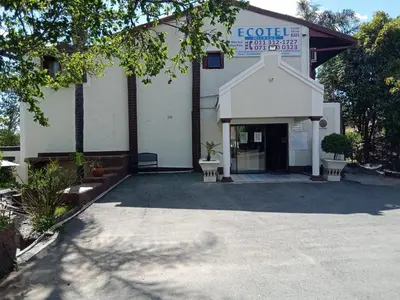 a building with a sign on the front of it at Ecotel Midrand in Midrand