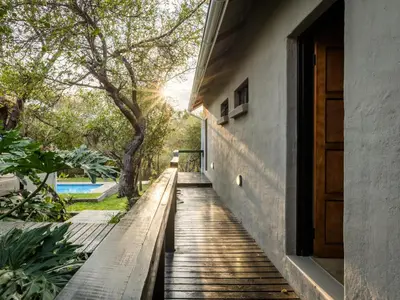 a wooden walkway leading up to a house at The Blyde Canyon House in Hoedspruit