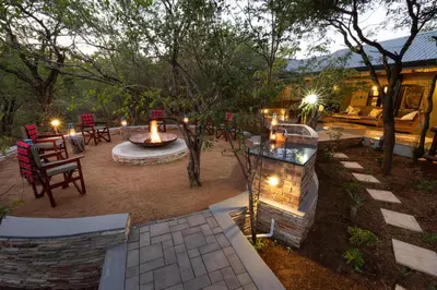 an aerial view of a patio with a fire pit at Africa House in Hoedspruit