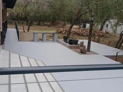a skateboard ramp in a park with trees at Tswenyane Kruger Lodge in Marloth Park
