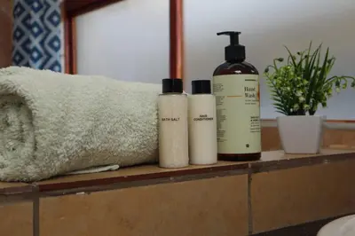 three bottles ofodorizers are sitting on a counter at Spacious and luxury 3 bedroom apartment in Midrand