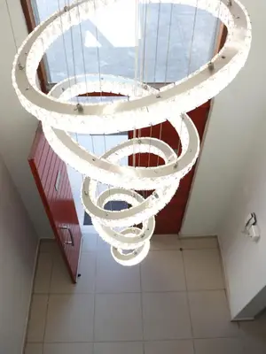 a large white chandelier hanging from a ceiling at AZALEA LODGE in Midrand