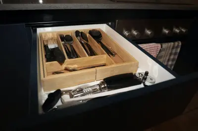 a wooden box with knives and a bottle in it at Large 3 Bedroom Apartment in Midrand, Waterfall City - More space than a hotel room - Ideal for families, groups and work trips - 19 Elizabeth Place in Midrand
