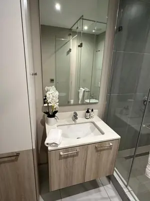 a bathroom with a sink and a shower at Menlyn Maine Residences 1 bedroom Apartment 505 in Pretoria
