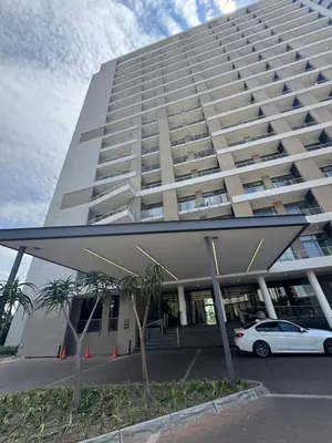 a large building with a car parked in front of it at Menlyn Maine Residences 1 bedroom Apartment 505 in Pretoria