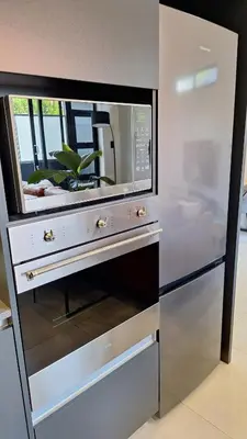 a microwave oven sitting inside of a kitchen at Luxurious Upmarket Apartment in Pretoria