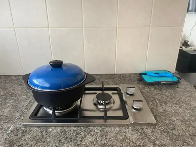 a blue pot sitting on top of a stove at Mamuka Africa in Midrand