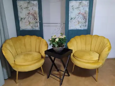 two yellow chairs and a table with a plant on it at Serendipity in Kampersrus AH