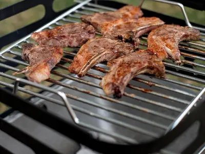 a bunch of meat cooking on a grill at Brooklyn Blok in Pretoria