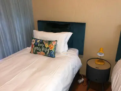 a bed with a pillow that reads keep mummy at Airbnb at Bailyes in Pretoria