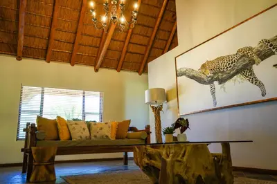 a living room with a couch and a table at Lucca House in Musina
