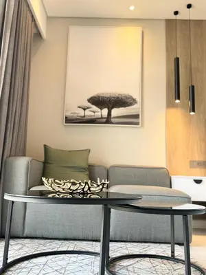 a living room with a table and a couch at The Trilogy Apartment MM 51011 in Pretoria