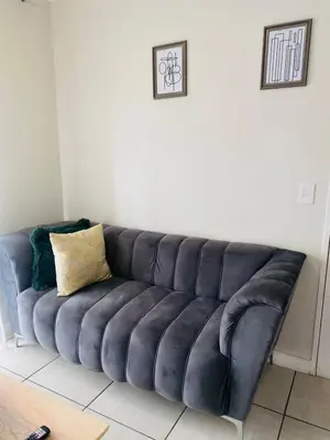 a black leather couch in a living room at Kayalako at The Blyde - Blue Crystal Lagoon in Pretoria