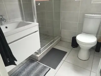 a bathroom with a toilet and a shower and a sink at Kayalako at The Blyde - Blue Crystal Lagoon in Pretoria