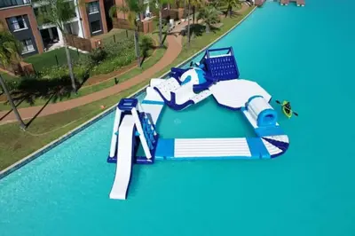 a water slide in the middle of a swimming pool at Kayalako at The Blyde - Blue Crystal Lagoon in Pretoria