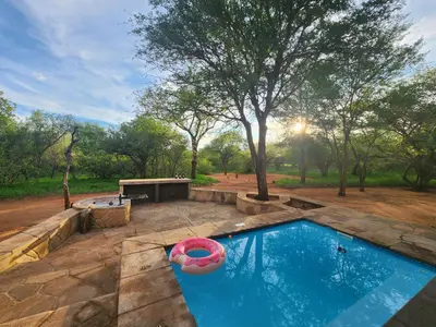 a swimming pool with an inflatablelatablelatable at Stella Bush Villa in Hoedspruit