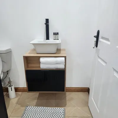 a bathroom with a sink and a toilet at Le Bamboo Guest House And Boat Cruise in Hartbeespoort