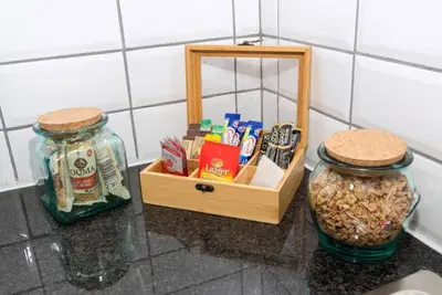 a counter with two jars and a box of nuts at Fig Tree in Pretoria