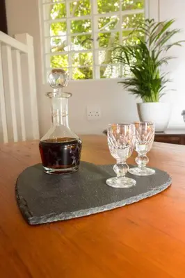 a bottle of wine and two glasses on a table at Hummingbird in Pretoria