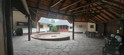 a large room with a pool in the center of a house at Lama Lama Game Reserve in Mount Hope