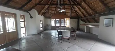 a dining room with a table and chairs at Lama Lama Game Reserve in Mount Hope