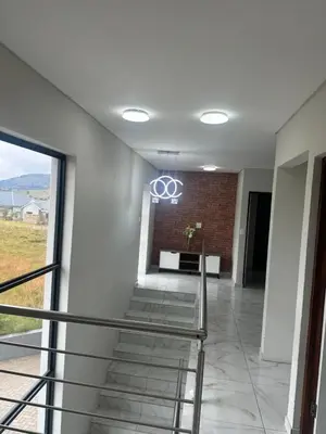 a room with a stairway with a building at 955 Highlands Gate Golf Estate in Dullstroom