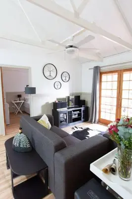 a living room with a couch and a table at Lala Lapa Self Catering Accomodation in Nelspruit