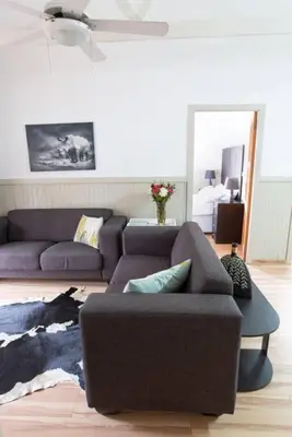 a living room with two couches and a couch at Lala Lapa Self Catering Accomodation in Nelspruit