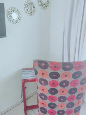 a room with a chair and two mirrors on the wall at Choosers Express Boutique Hotel and Spa - Room 2 in Centurion