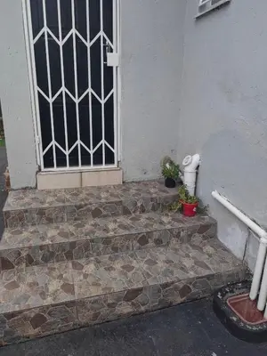 a front door of a house with a window and some plants at Choosers Express Boutique Hotel and Spa - Room 2 in Centurion