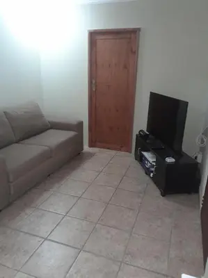 a living room with a couch and a flat screen tv at Kruger Bush Retreat in Marloth Park