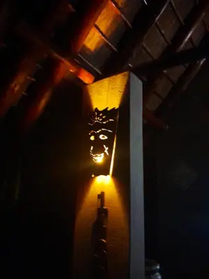a light on a wall in a dark room at Kruger Bush Retreat in Marloth Park