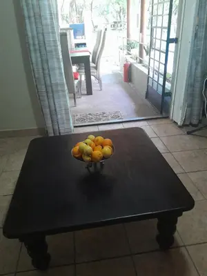 a bowl of fruit sitting on a table at Kruger Bush Retreat in Marloth Park