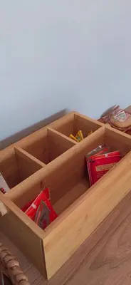 a wooden box filled with books on a table at Mulala Luxury Guesthouse in Thohoyandou