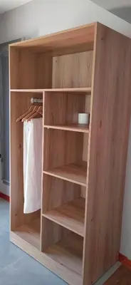 a wooden book shelf in a room at Mulala Luxury Guesthouse in Thohoyandou
