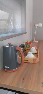 a toaster sitting on top of a wooden counter at Mulala Luxury Guesthouse in Thohoyandou