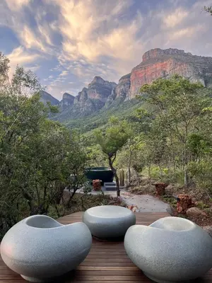 four chairs on a deck with a view of a mountain at Marepe Mountain View in Kampersrus AH
