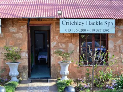 a shop with a sign on the front of a building at Critchley Hackle Lodge in Dullstroom
