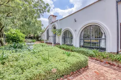 an exterior of a white building with a garden at Chic Midtown Studio-1 Bed-solar-pool-fibre-samrand in Centurion