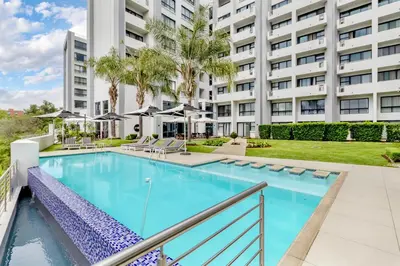 an image of a swimming pool at a building at Nosivu@Regency Apartment Hotel in Pretoria