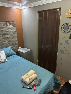 a bedroom with a bed with two towels on it at Lake Boutique Hotel in Thohoyandou