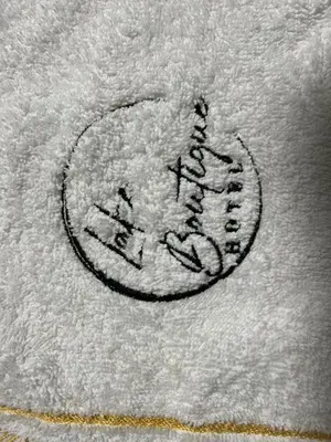 a drawing of a circle on a white towel at Lake Boutique Hotel in Thohoyandou